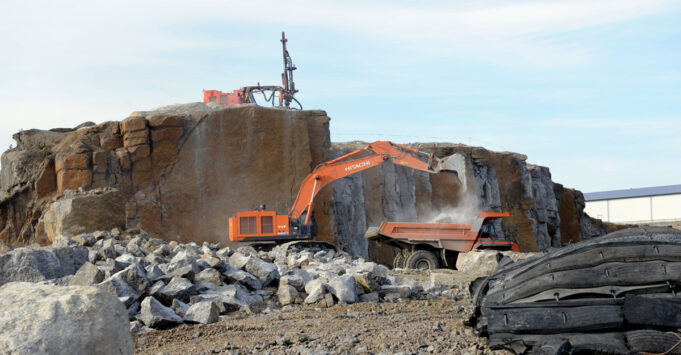 Machines crushing rock.