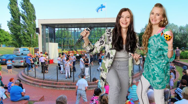 Kaksi naista tanssii ja laulaa. Taustalla lavatanssi ulkolavalla.